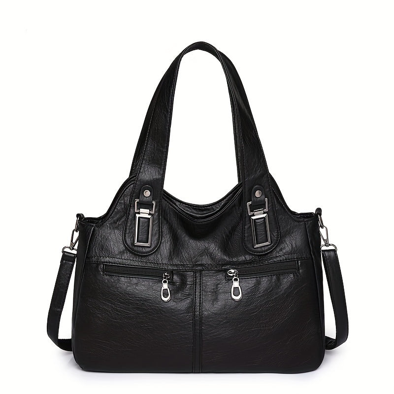 Stylish women's crossbody bag with multiple pockets, detachable strap, chic design, zip closure, and polyester lining.