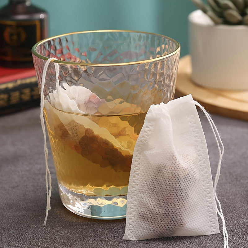 Pack of 10 or 20 Disposable Tea Filter Bags with Drawstring Closure, Made of Non-Woven Fabric for Brewing Tea and Spices