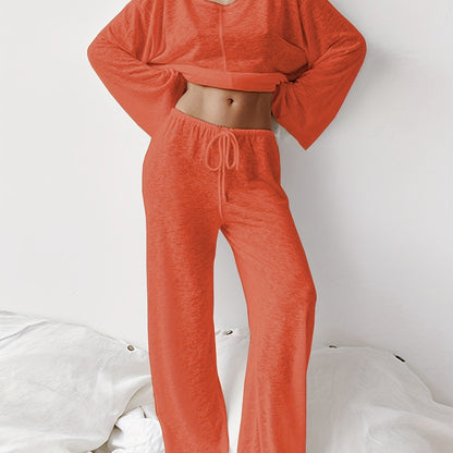 Women's two-piece set of loose and comfortable home clothes made with micro-permeable fabric, featuring round neck and long sleeves.