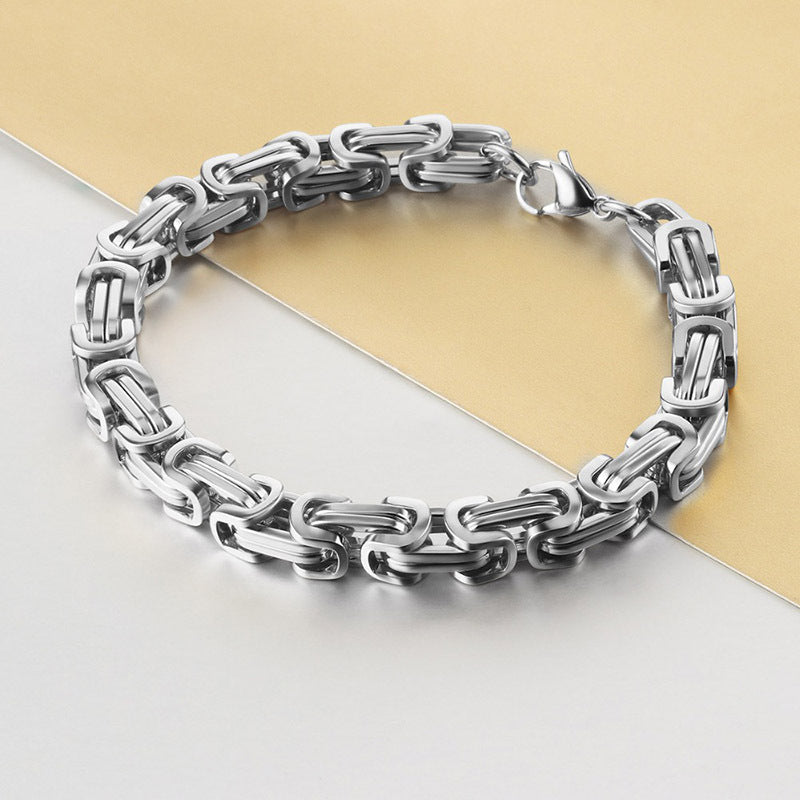 Stylish men's stainless steel chain bracelet in 8mm width, featuring a sturdy Byzantine box chain design. Available in black, golden, or silvery colors, this hip hop inspired bracelet is the perfect accessory for men looking to add some flair to their