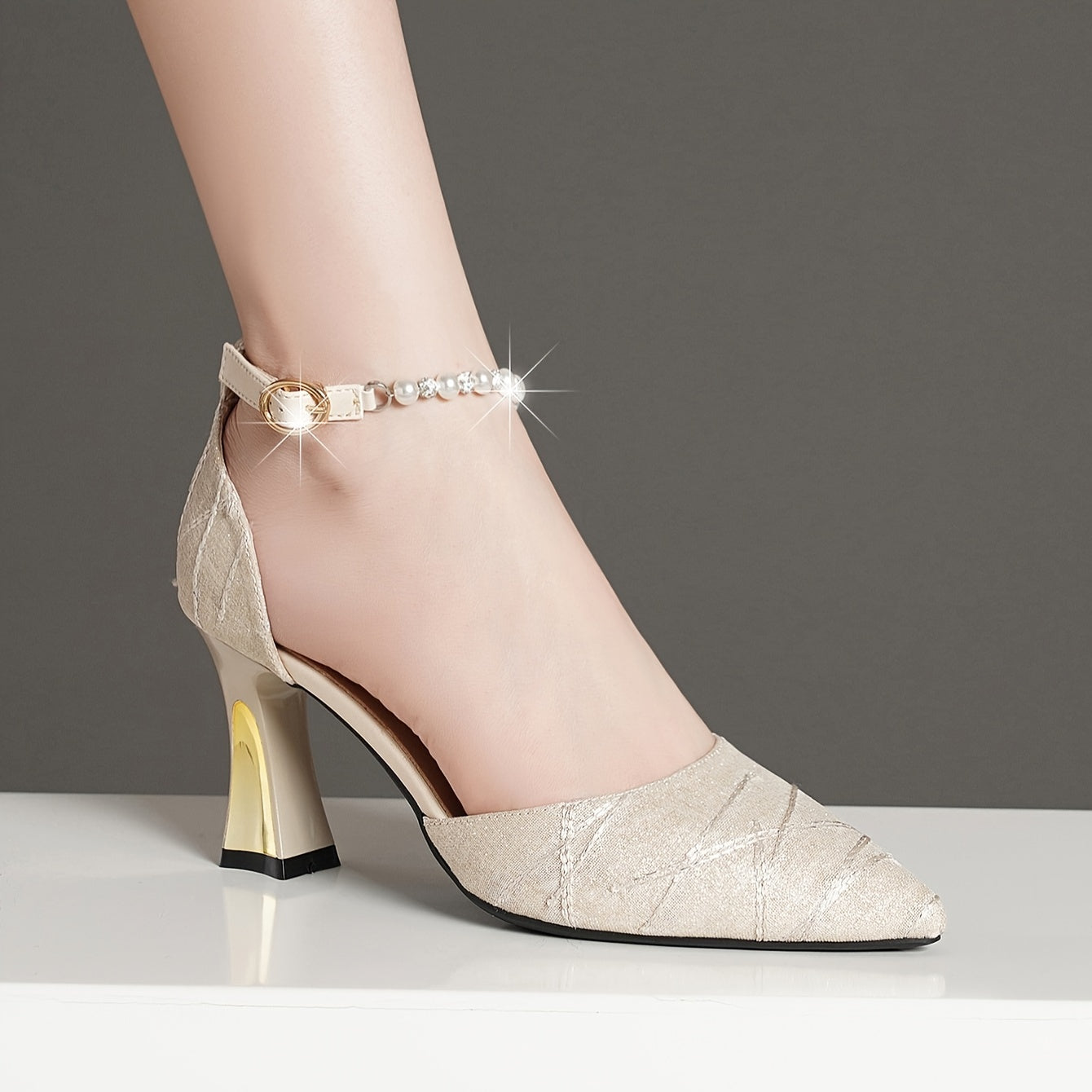 Faux pearl ankle-strap sandals with chunky heel for comfortable and elegant party wear.