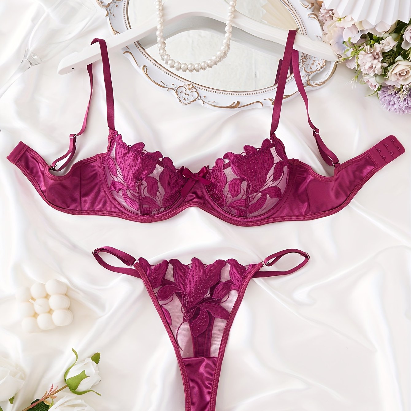 Floral embroidered lingerie set for women - sheer bra and thong panty, medium support, no padding, with polyester and elastane.