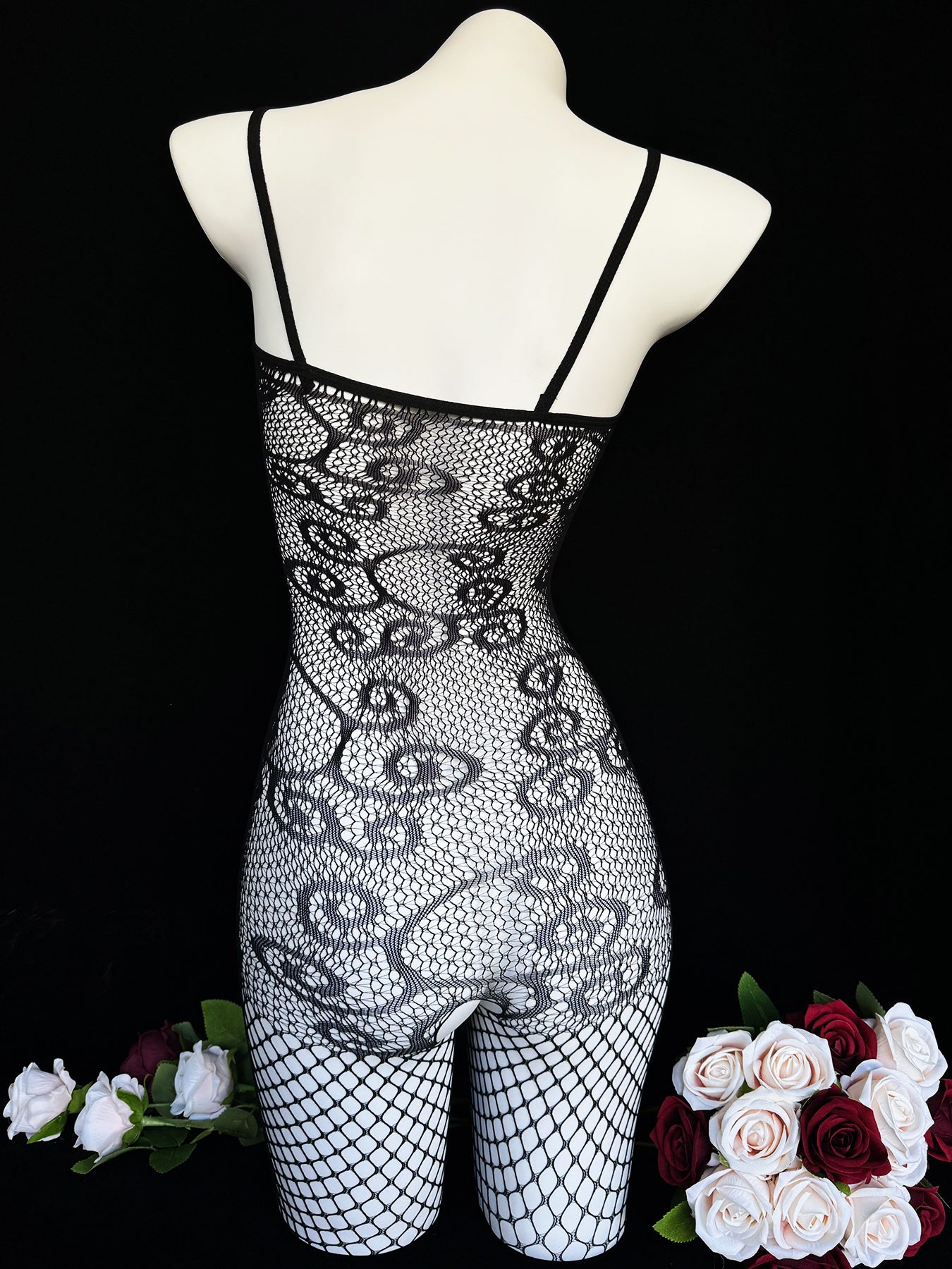 Sexy lace fishnet bodysuit for a romantic date or Valentine's Day. Black see-through stockings for confident nights.