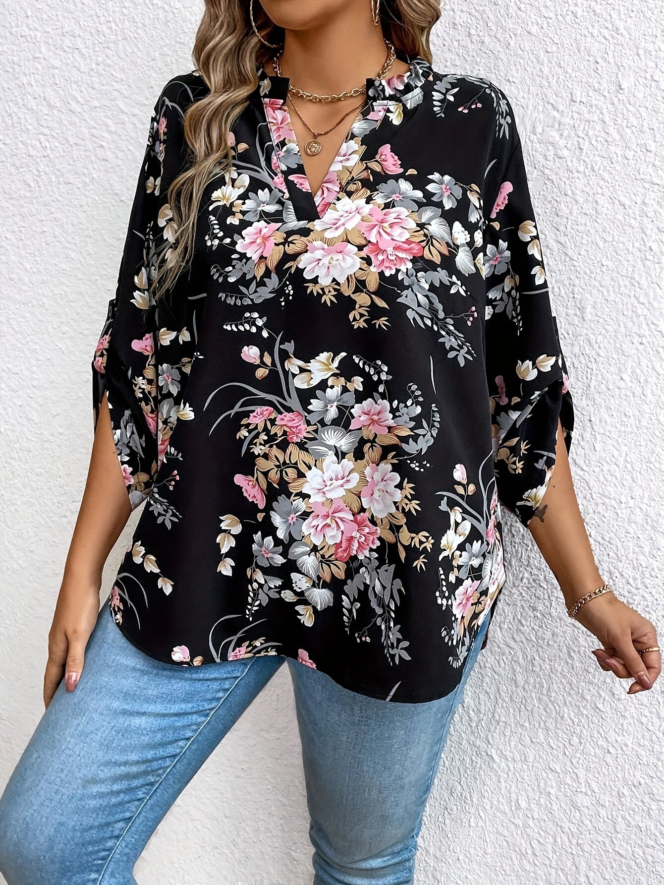 Elegant plus-size women's floral print blouse with ruffle sleeves in stylish black, perfect for casual to semi-formal occasions.