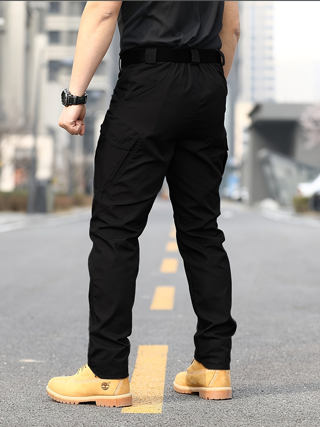 Men's slim combat pants for military training and outdoor activities, featuring a casual and tactical design.