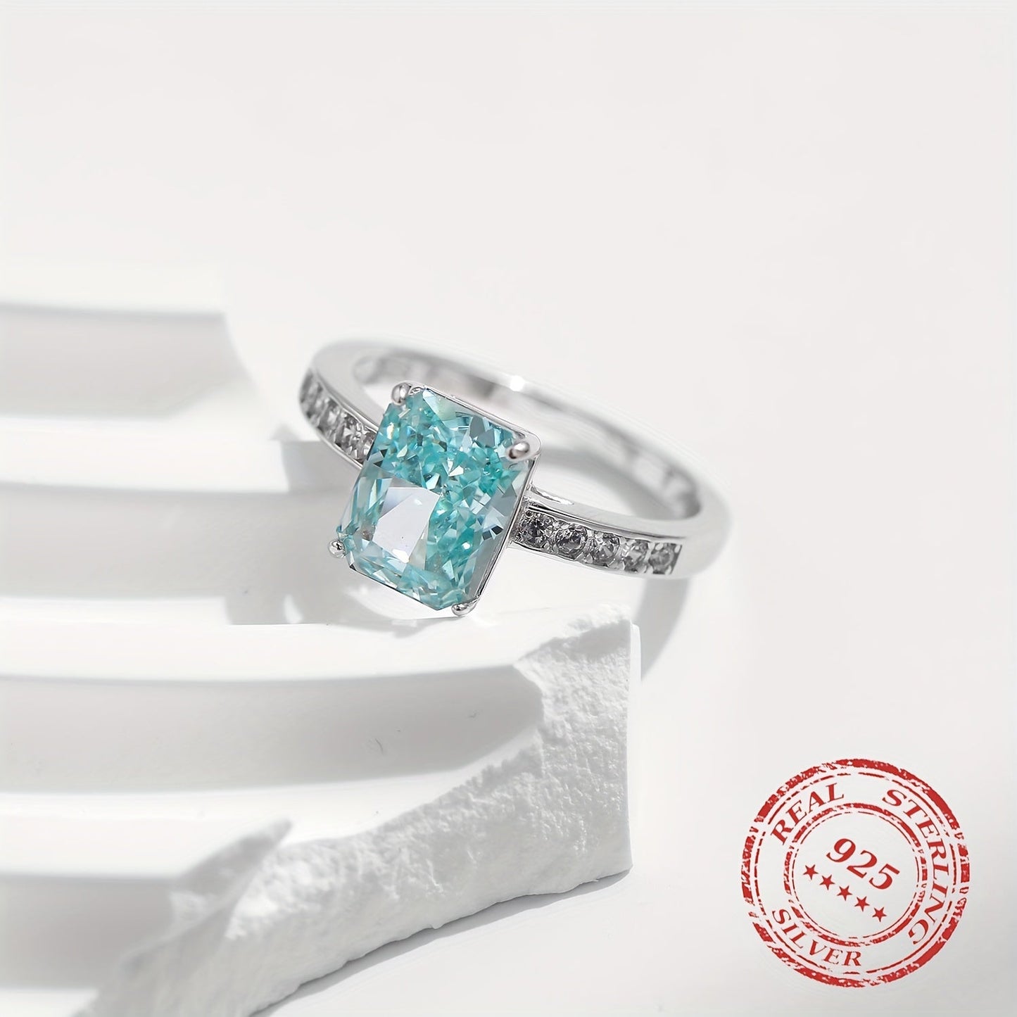 YANLOK presents a stunning 925 sterling silver ring with Paraiba blue cubic zirconia, ideal for gifts and special occasions. This elegant vintage-inspired piece exudes a festive sparkle that is sure to impress.