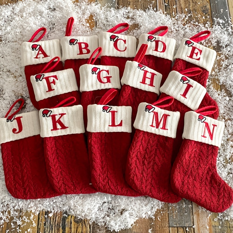 11" Christmas stocking with knitted alphabet design, perfect for hanging on the Xmas tree or using as a gift bag. Made of polyester.