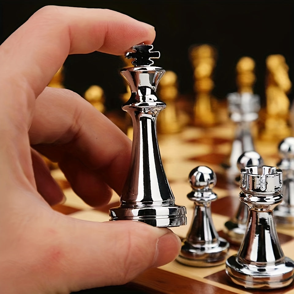 Luxurious chess set with silver pieces on a wooden folding board with zinc alloy pieces.