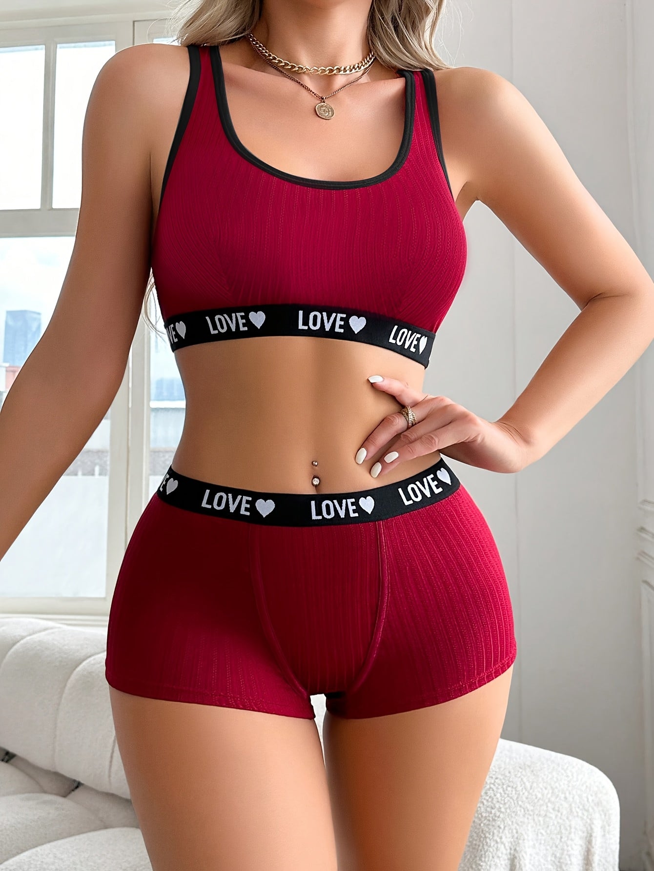 Athletic-inspired lingerie set for women featuring a tank bra and boyshorts with letter print and contrast trim.