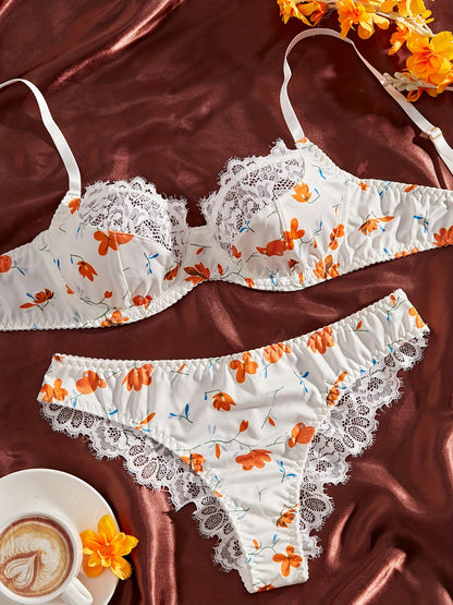 Stylish lace-trimmed floral print bra and panty set for women. Comfortable polyester blend, machine washable.