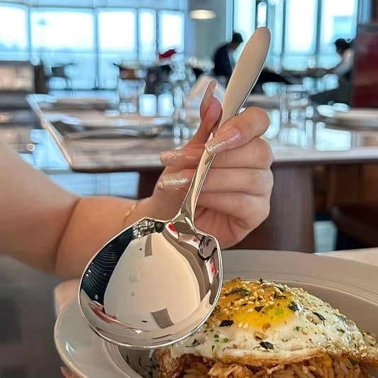 Elegant oversized stainless steel spoon for serving rice, eggs, and more with a shiny, durable finish.