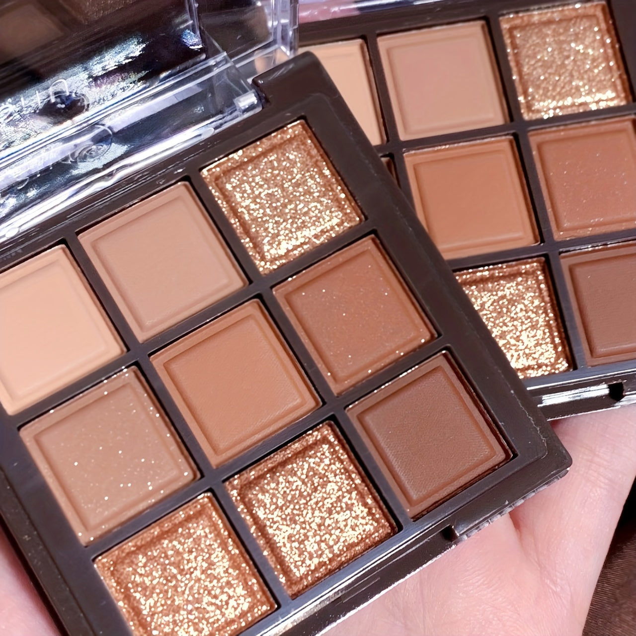 9-color chocolate brown eyeshadow palette with natural matte, shimmer, and glitter pigments. Waterproof, sweat-proof, and professional beauty makeup kit.