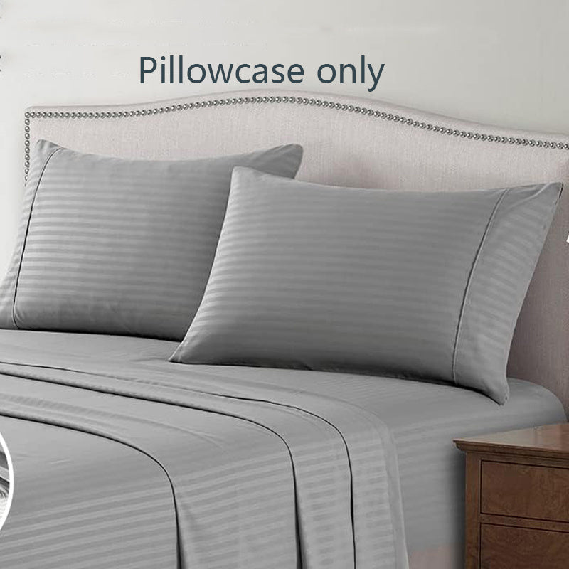 A pair of striped pillowcases made from soft, breathable woven polyester. These pillowcases are machine washable and have a sanded finish for added comfort. They do not include a pillow insert and are made from non-printed lightweight fabric with a 90gsm