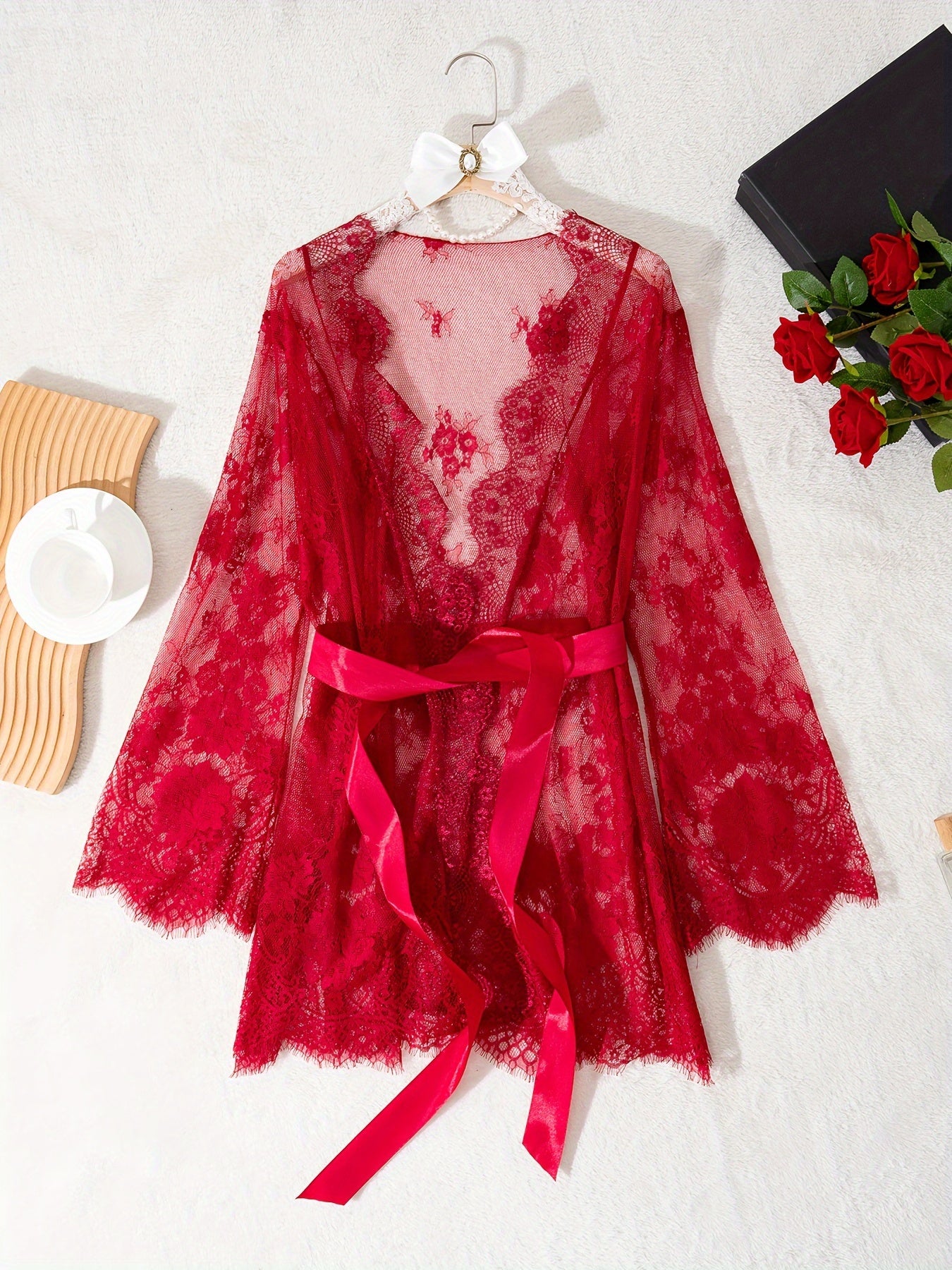 Red lace intimate nightgown with tie belt, long sleeves.