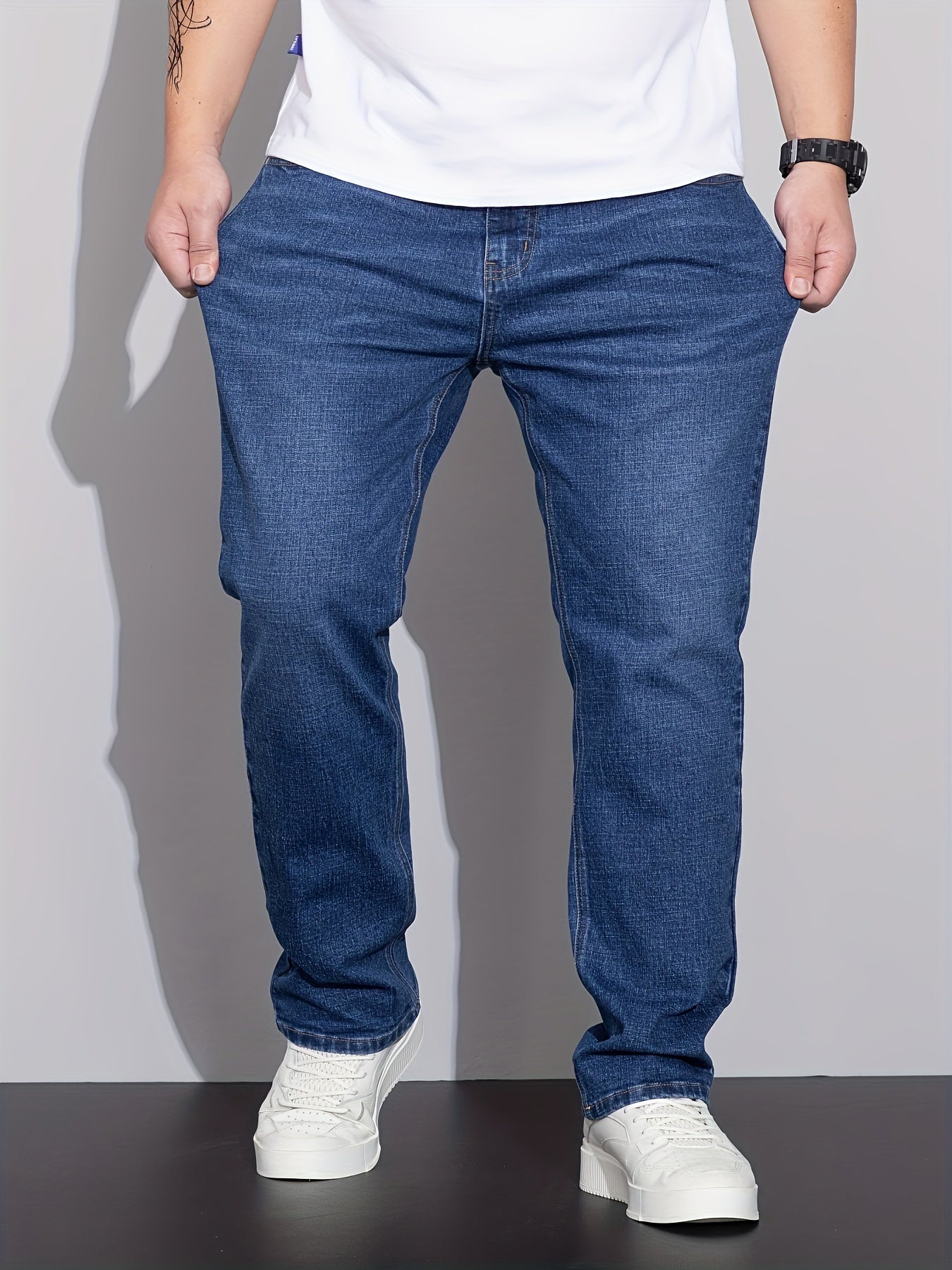 Men's plus size denim jeans with comfort flex, straight leg, washed detail, solid color, cotton blend with stretch.