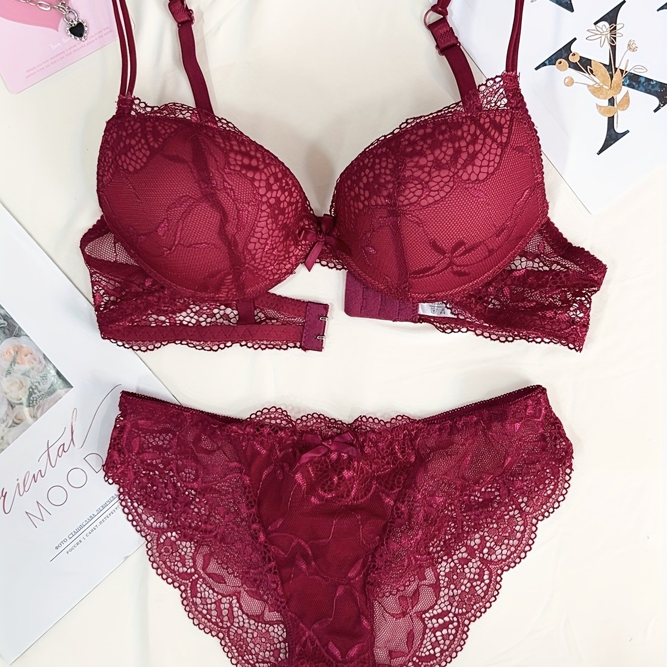 Medium support lace bra and panty set with contrast lace detail, made of 85% polyamide, 7% polyester, 5% elastane, and 3% viscose. Features drop waist briefs and chest pad.