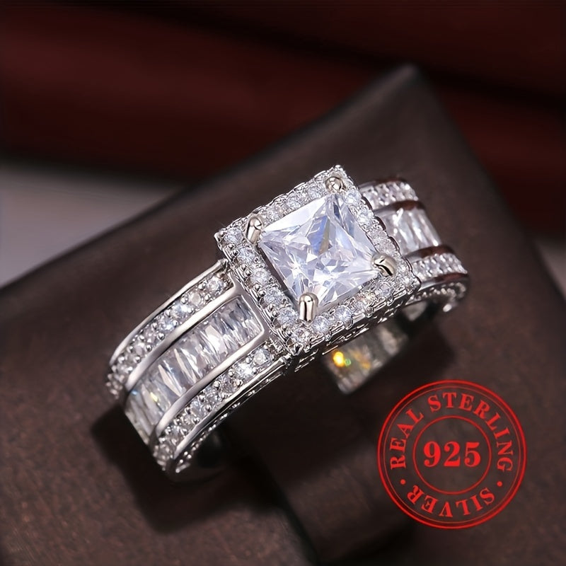 Perfect for weddings and banquets, this luxurious and high-end piece of jewelry for ladies is a stunning choice. Crafted from 7.7g of S925 sterling silver, this classic 4-prong set square cut zirconia ring sparkles beautifully. Add a touch of fashion and