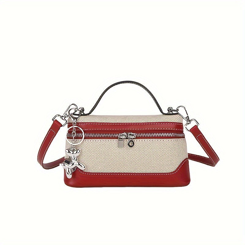 Retro-inspired mini crossbody bag for women in colorblock design, with adjustable strap and zip closure in black/blue/dark red/light brown/orange.