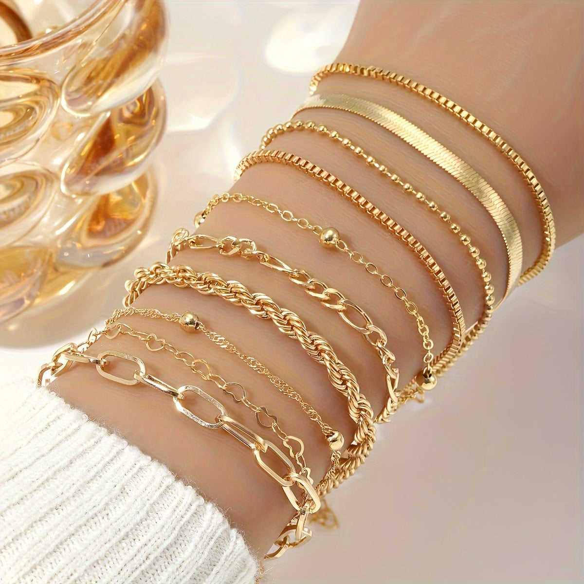 Set of 10 elegant golden-toned bracelets with multi-layer designs and heart charms, ideal for daily wear or parties.