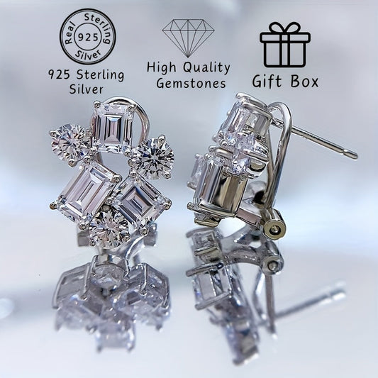 Included in the Christmas gift box are 925 sterling silver stud earrings featuring synthetic gemstones in a cluster design. These luxury and elegant earrings have no plating and are perfect for a holiday theme. The ear needle material makes them ideal