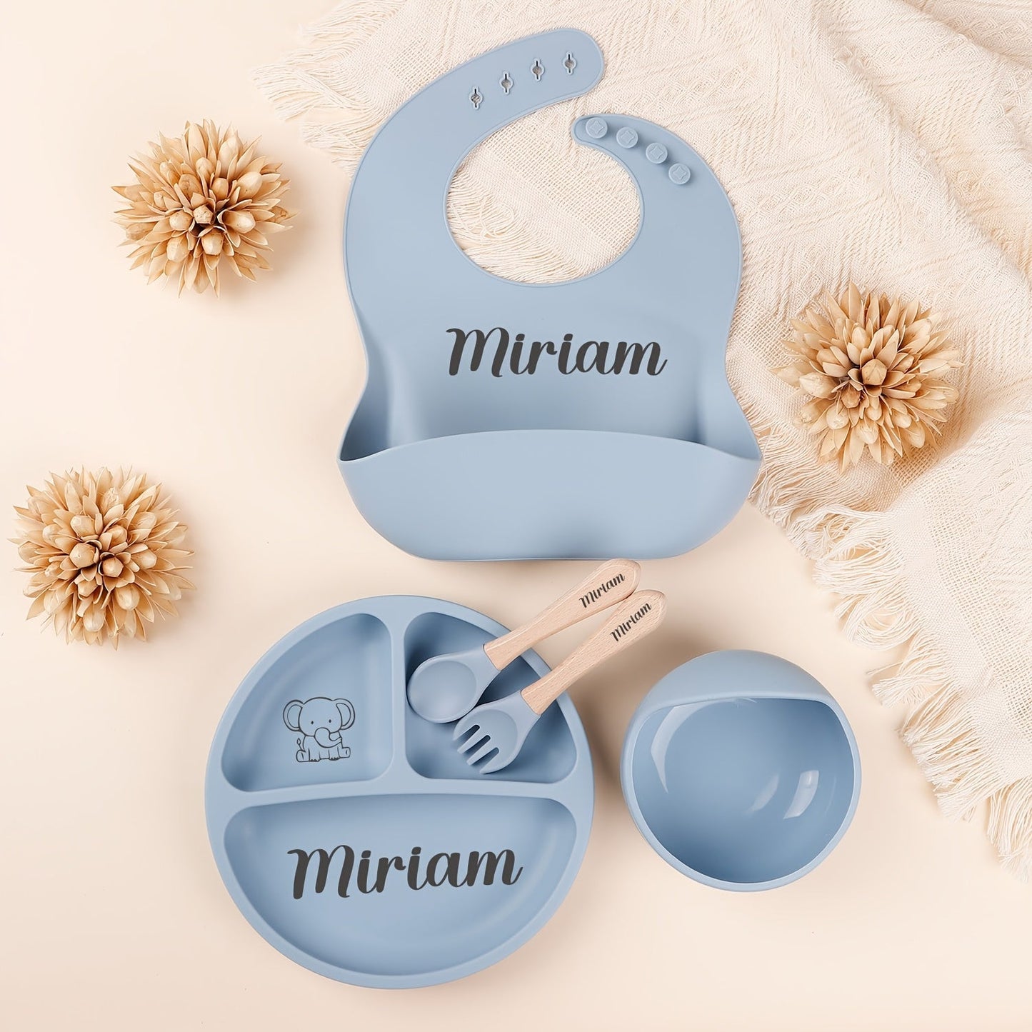 Personalize your child's mealtimes with our Customizable Feeding Set! This set includes a silicone weaning plate with your child's name and a fun cartoon design, along with a spoon, fork, and bowl. It makes the perfect shower gift for new parents.