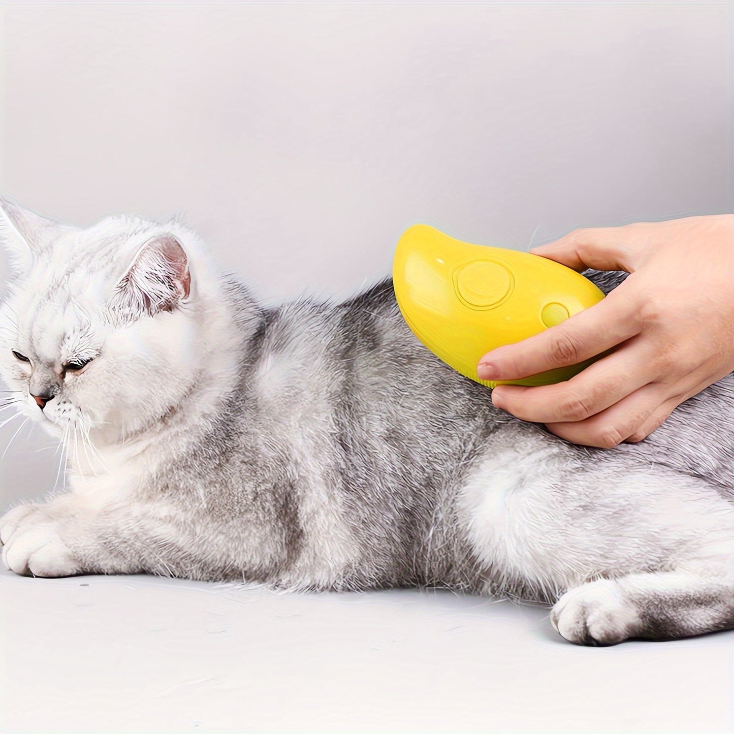 Self-cleaning Cat Steam Brush that removes tangled and loose hair, massages pets, and removes pet hair for both cats and dogs.