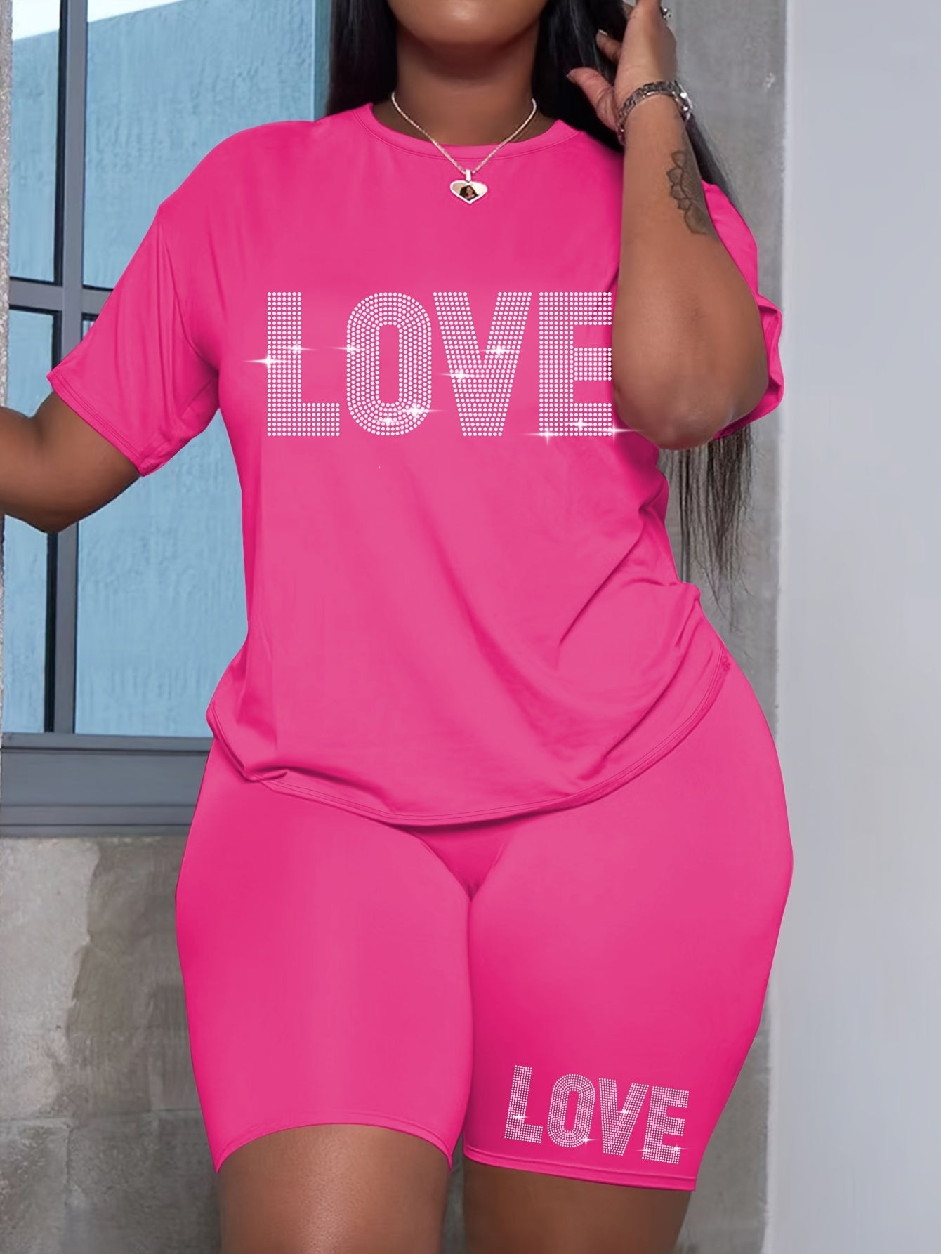 Plus-size women's casual polyester T-shirt and shorts set with alphabet love print, ideal for daily wear.