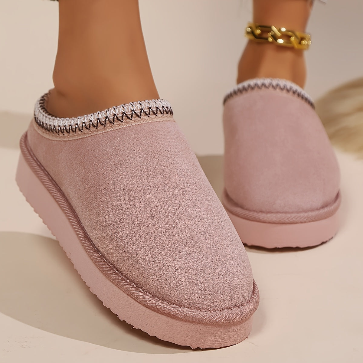 Warm and cozy women's winter slippers with plush lining and anti-slip sole.