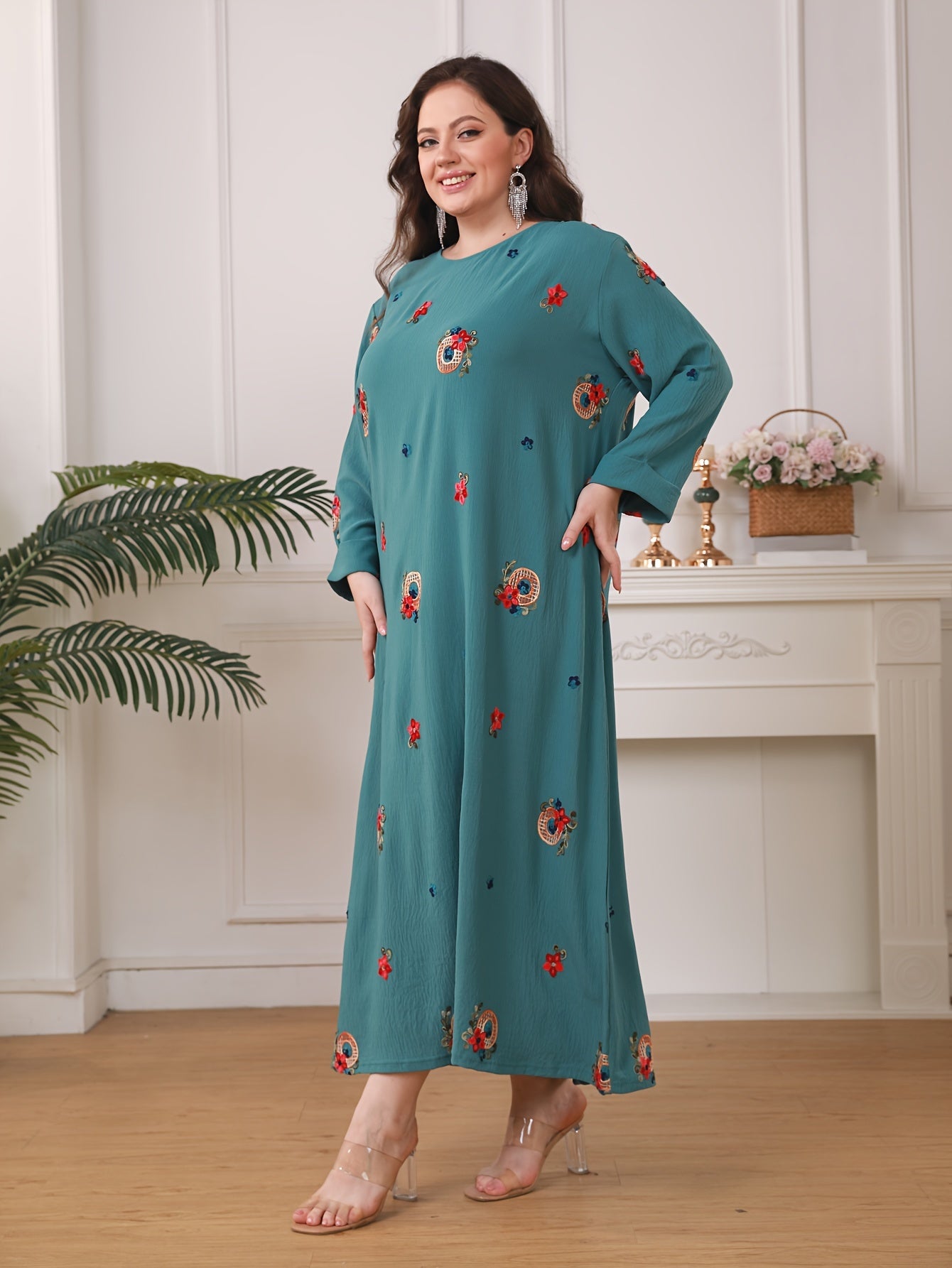 Elegant floral print women's plus size abaya with long sleeves and loose fit in traditional Middle Eastern style.