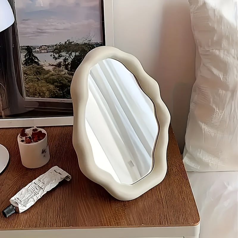 One stylish irregular desktop makeup mirror with adjustable plastic frame and glass surface for bathroom, office, and bedroom decor.