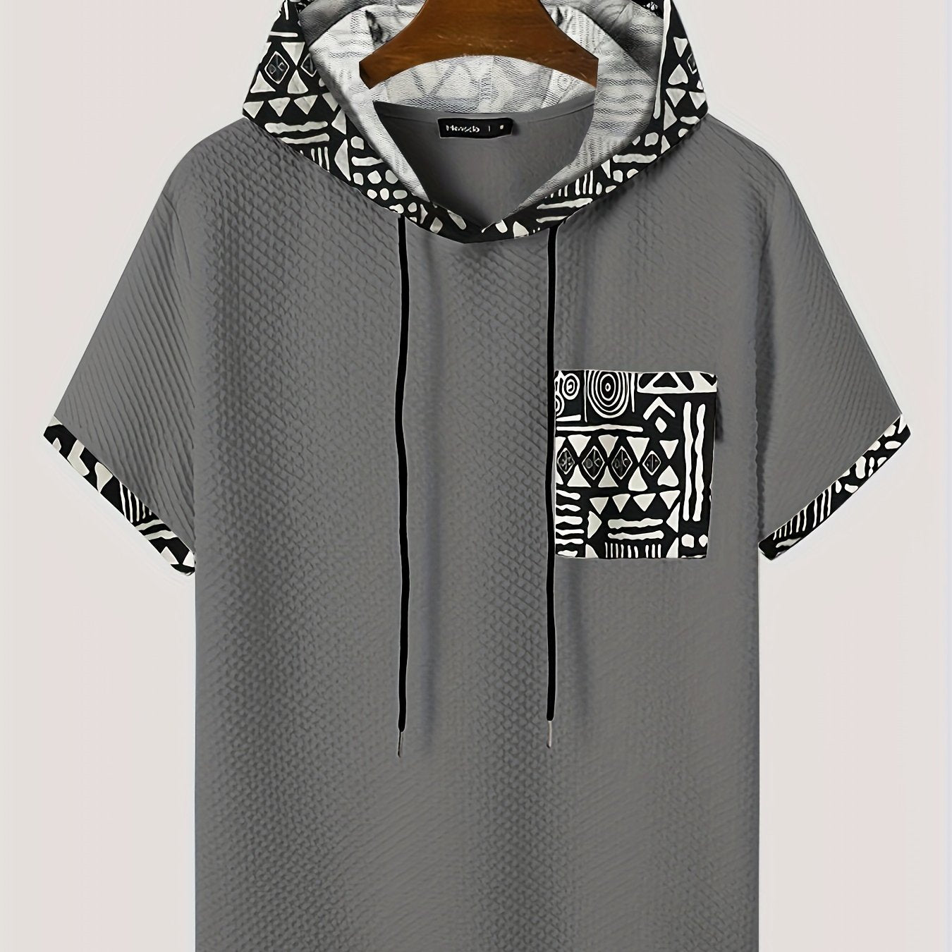 Men's plus size casual hooded t-shirt with geometric print, made from lightweight polyester fabric in gray with black and white patterns. Includes drawstring hood for comfortable fit and