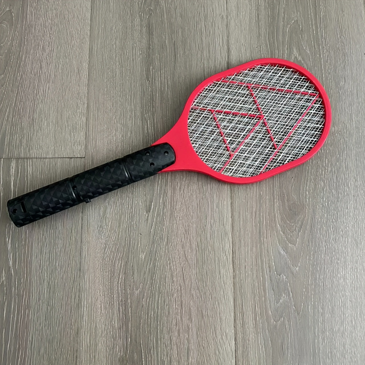 Electric fly and mosquito swatter that operates on batteries (AA batteries not included), made of durable plastic/aluminum/tin.