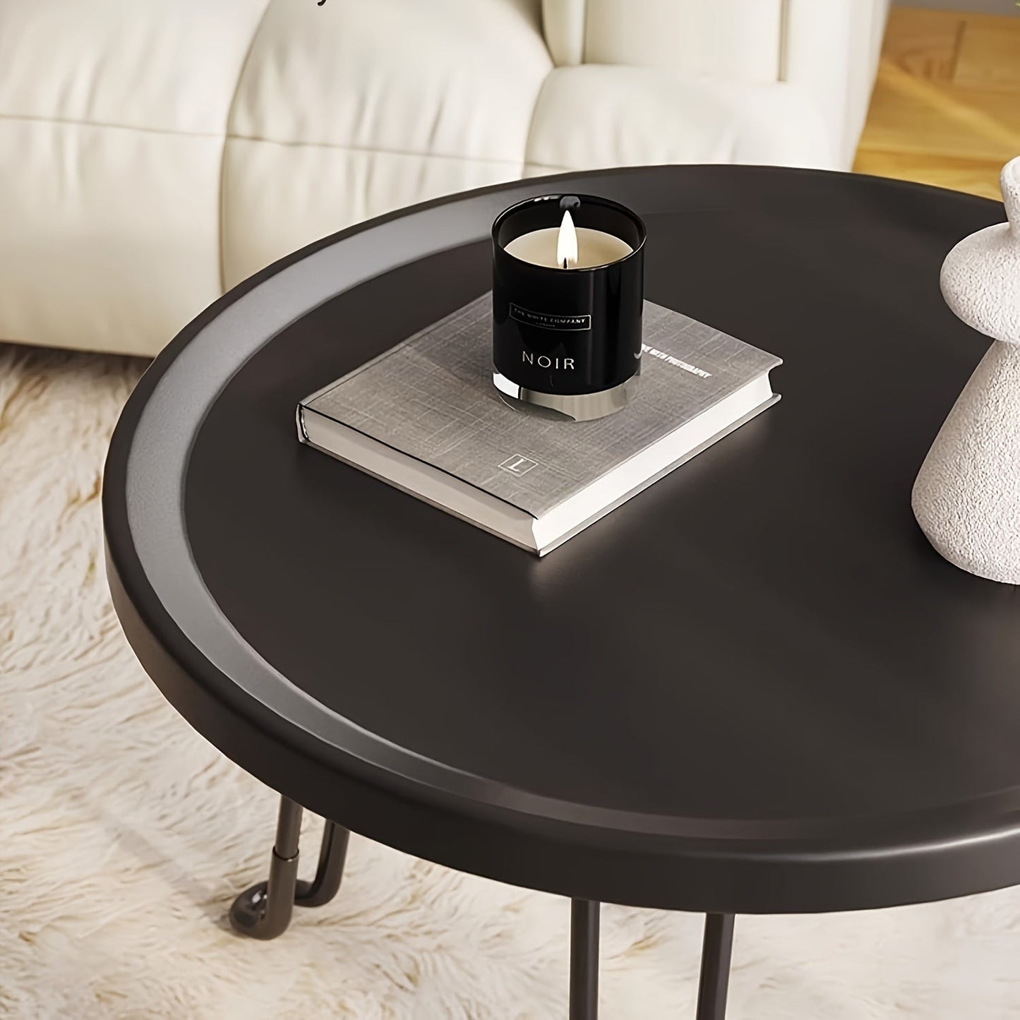 Compact and modern, this small round folding coffee table features a tray surface supported by three legs. Ideal for use as a bedside table in bedrooms and living rooms, this piece is perfect for compact spaces.