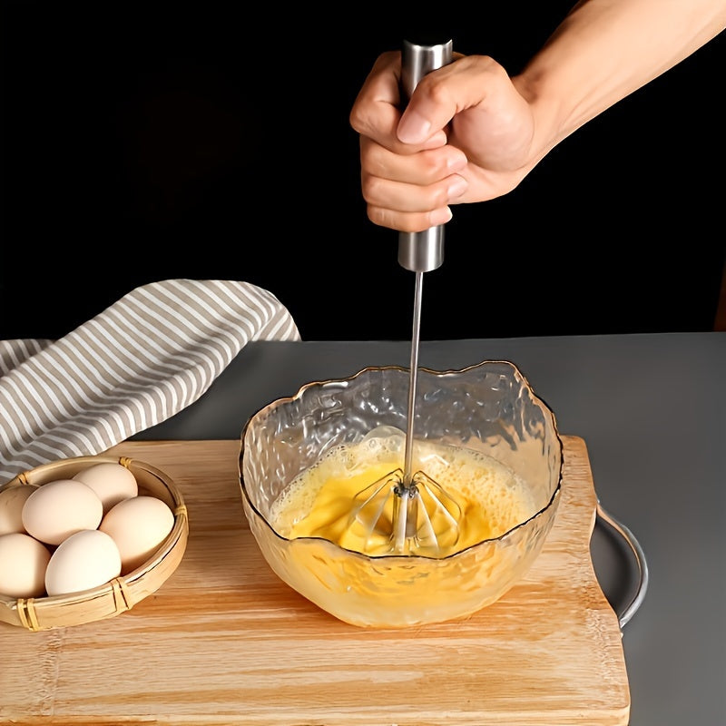 Essential kitchen gadget: Stainless steel whisk and milk frother for baking, eggs, and cream.