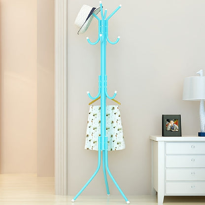 Multi-purpose, freestanding black metal coat rack with tree-style design for hanging clothes and hats in the bedroom.