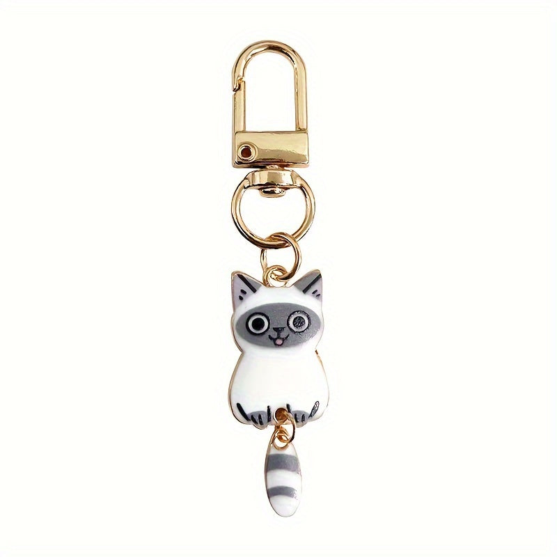 A collection of 7 adorable cat tail keychains made with zinc alloy featuring movable tails. Perfect as handbag charms and zipper pulls, these kitty keyrings make a fashionable accessory gift.