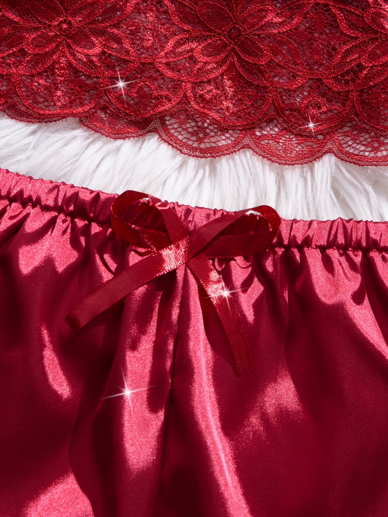 Valentine's Day lingerie set with floral lace, cami top, and bow shorts.