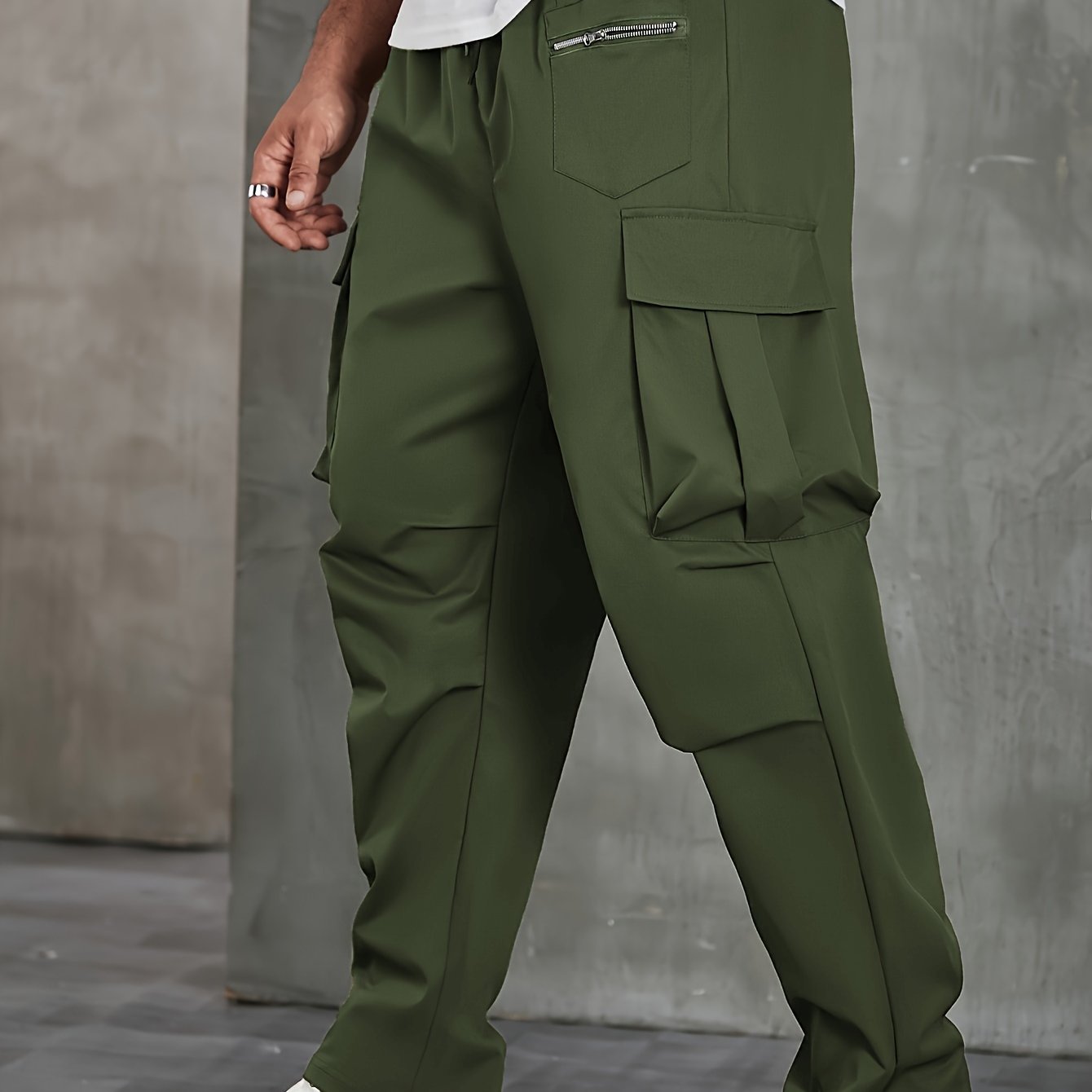 Men's solid cargo pants in plus sizes for spring and fall outdoor sports.