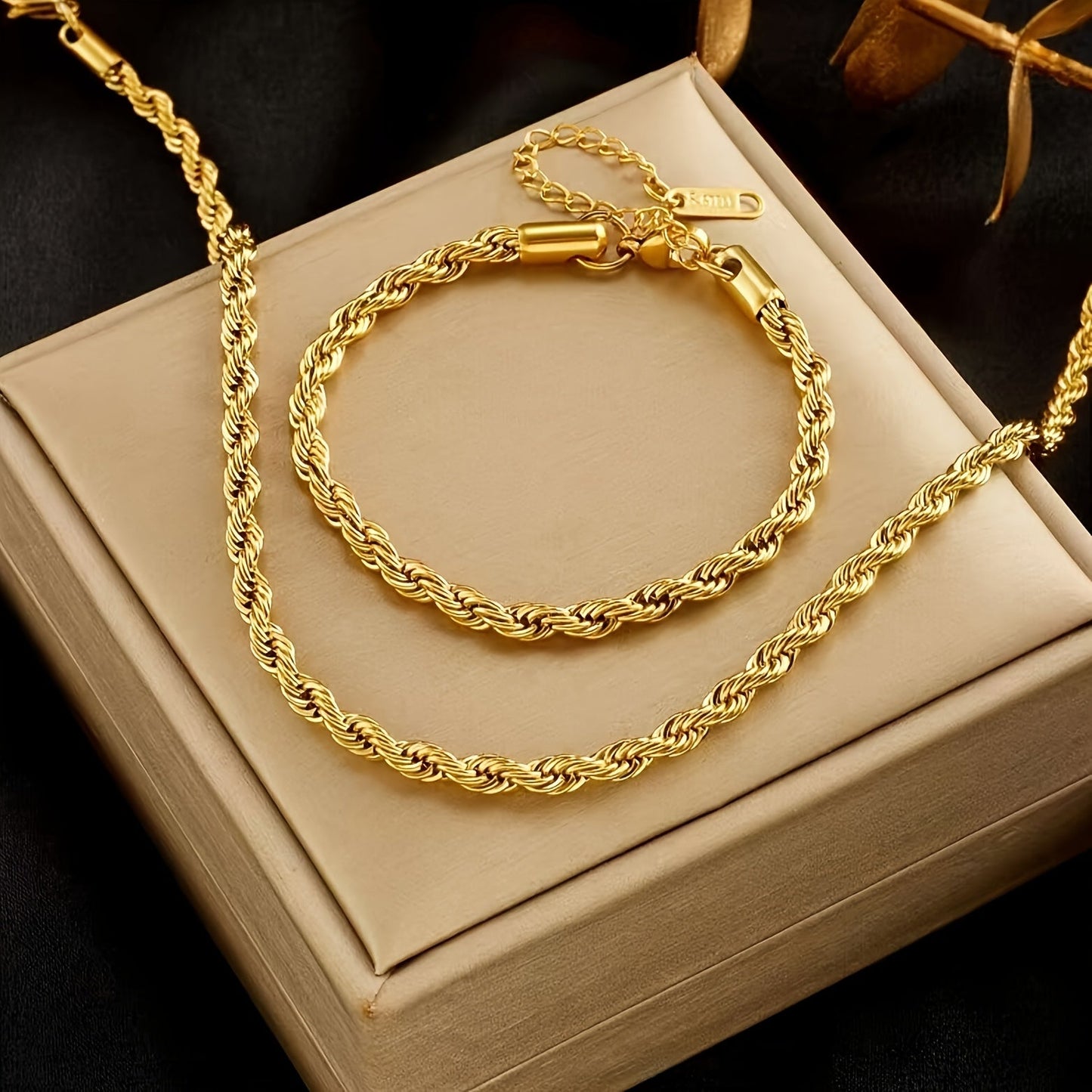 Retro and fashionable, this elegant two-piece set features a gold-plated stainless steel necklace and bracelet. Its simple design makes it a versatile accessory suitable for women, couples, or anyone looking to add a touch of glamour to their street