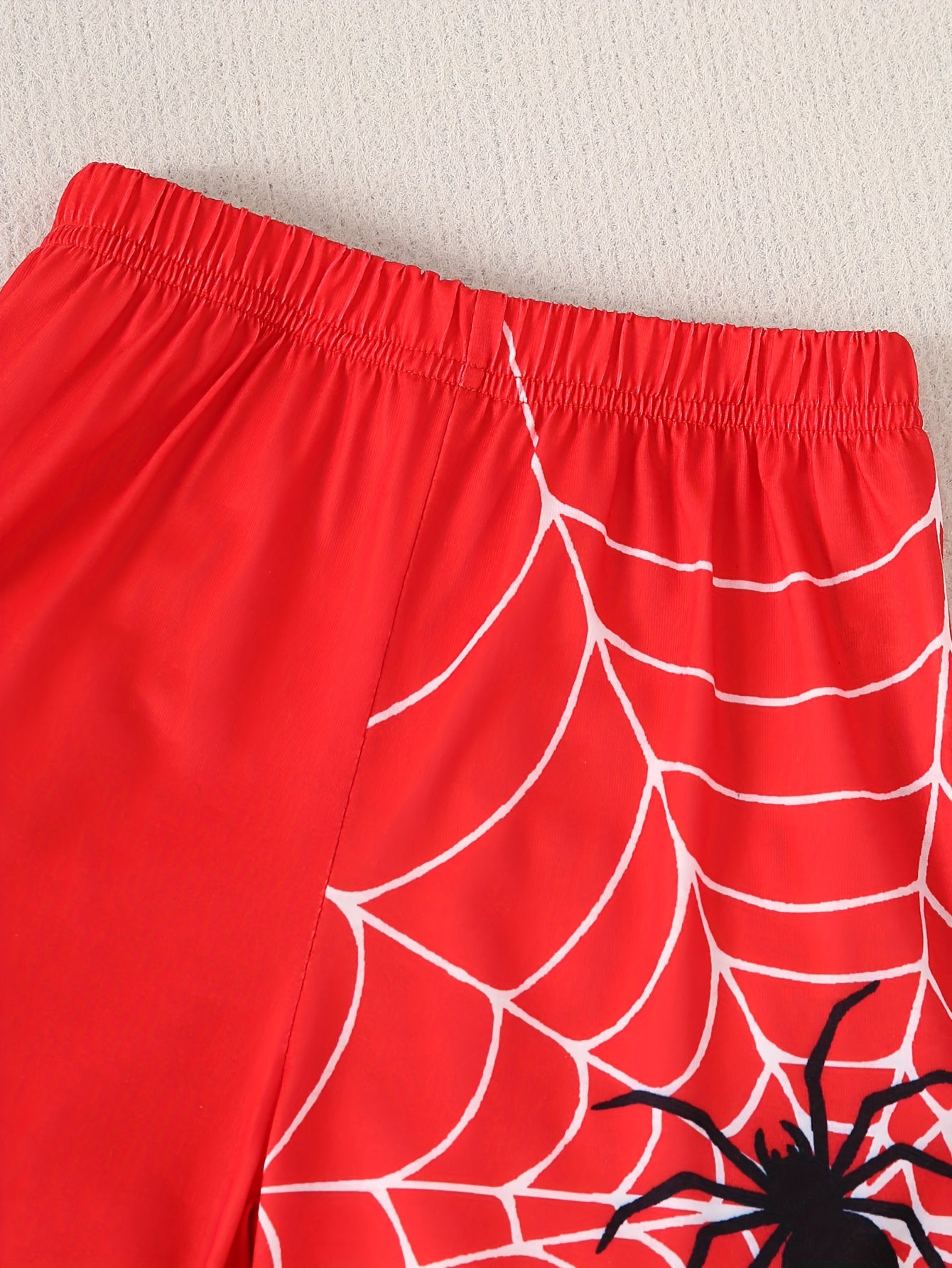 Boys 2-piece casual outfit set with spider web print tee and shorts for summer wear.