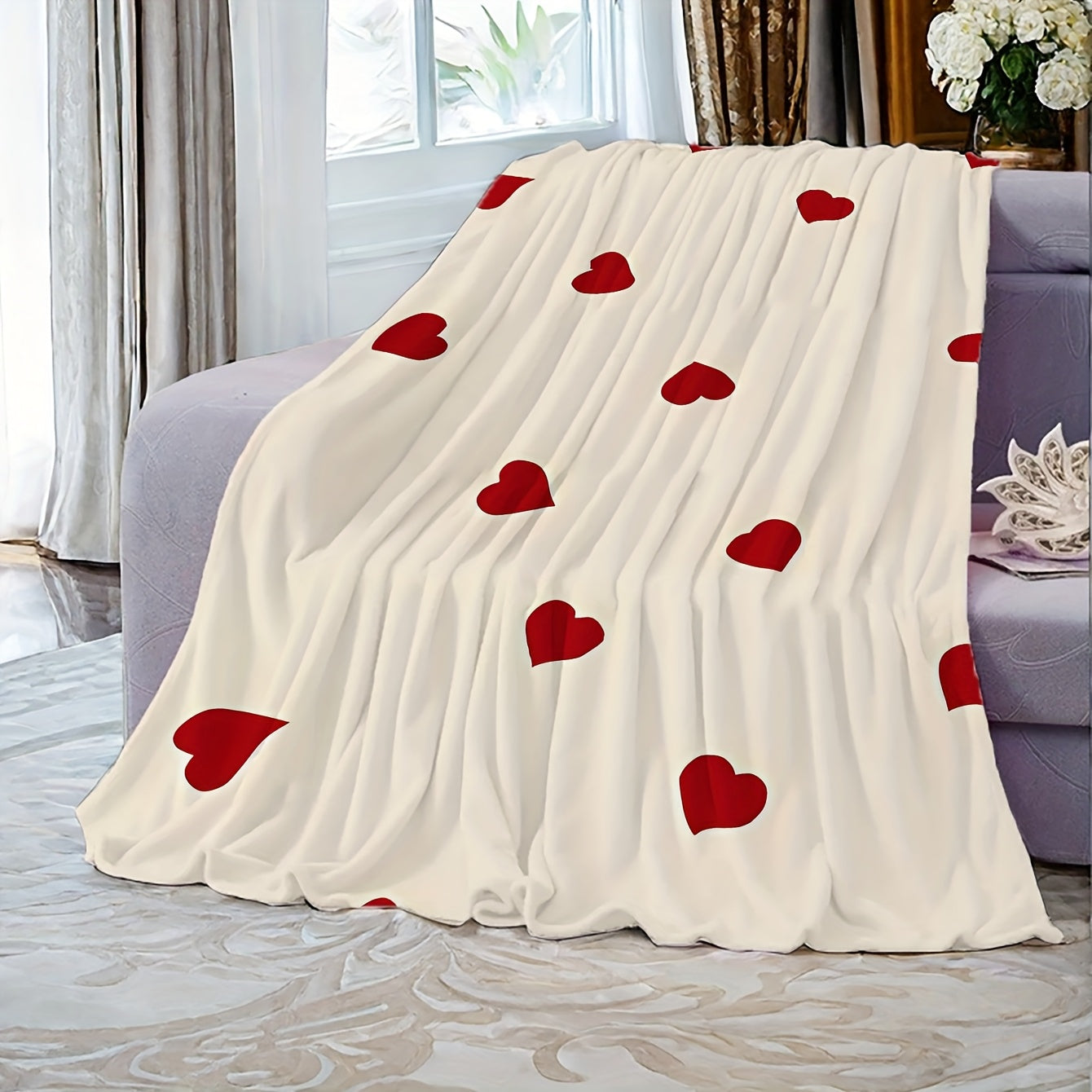 Soft sofa throw blanket featuring a red heart pattern for Valentine's Day. This cozy blanket is knit from warm polyester coral fleece and showcases a contemporary style. The digital print craftsmanship makes it perfect for use on the couch, bed, camping