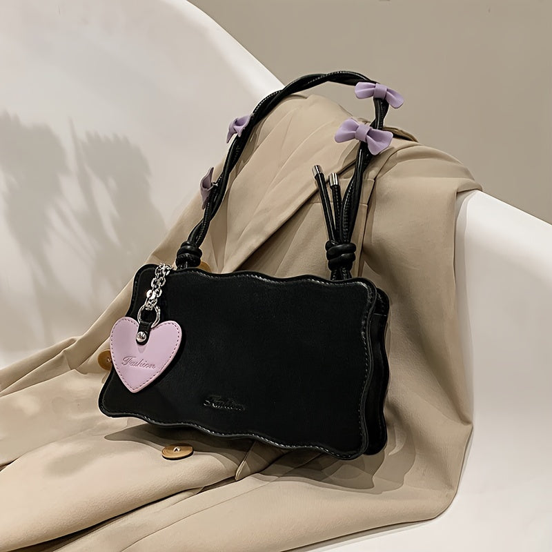 Baguette shoulder bag made of PU material with butterfly bow accents. Versatile and chic fashion accessory.