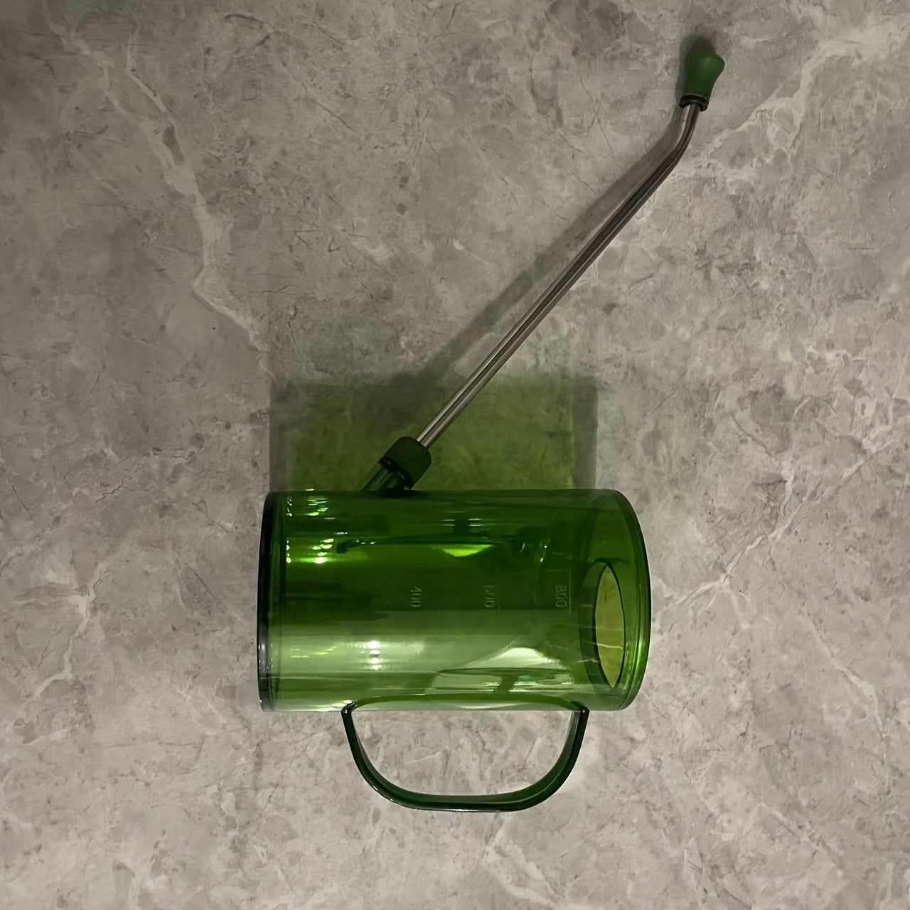 Durable plastic watering can with long spout, ideal for succulents and home gardening.