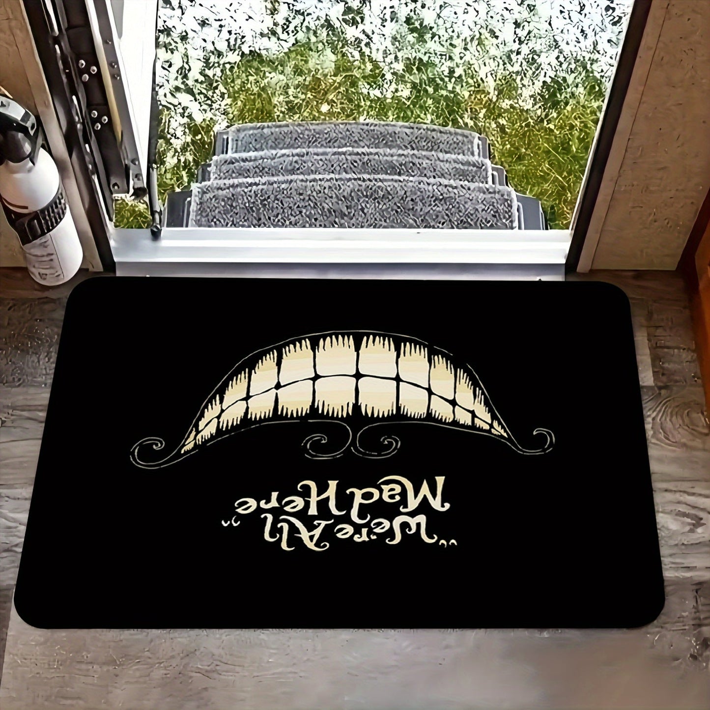 Welcome to Cheshire Smile Doormat - A soft and absorbent entrance mat made from polyester fleece, featuring a charming tooth and letter print design. This 1cm thick mat is anti-slip and perfect for your living room, bedroom, front door, or hallway. Add a