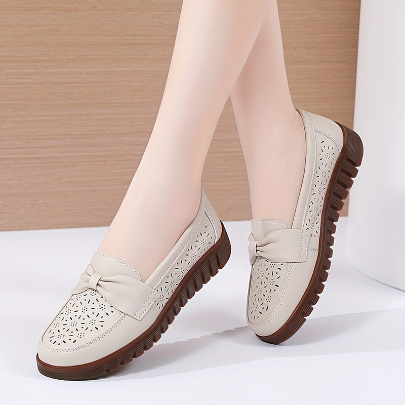 Women's breathable closed toe flat shoes with hollow out design.