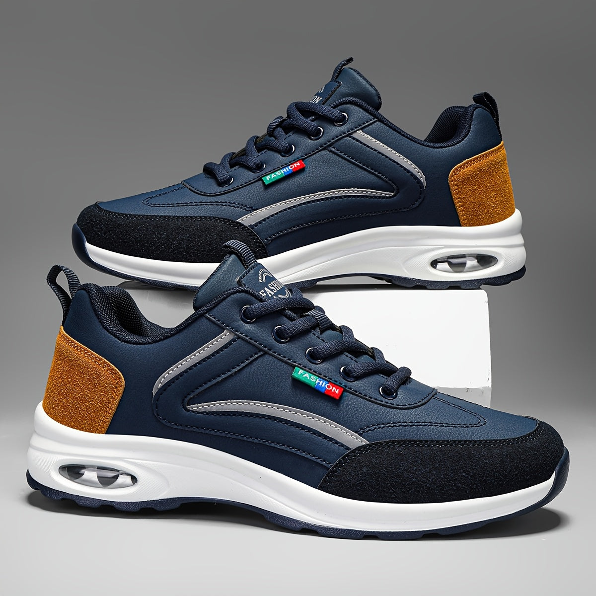 Men's two-tone road running shoes with air cushioning, durable rubber sole, fabric lining, lace-up closure, and low-top design for all seasons.