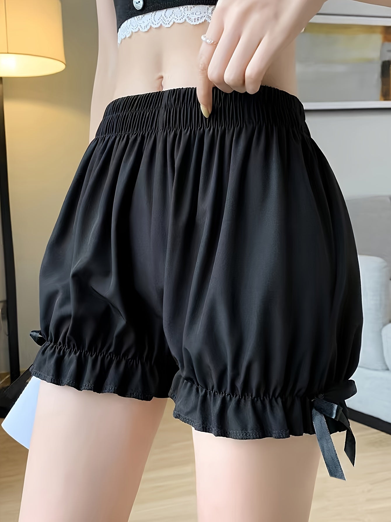 Women's summer sleep shorts made of lightweight woven fabric with bow detail, suitable for adults and provides menstrual protection.