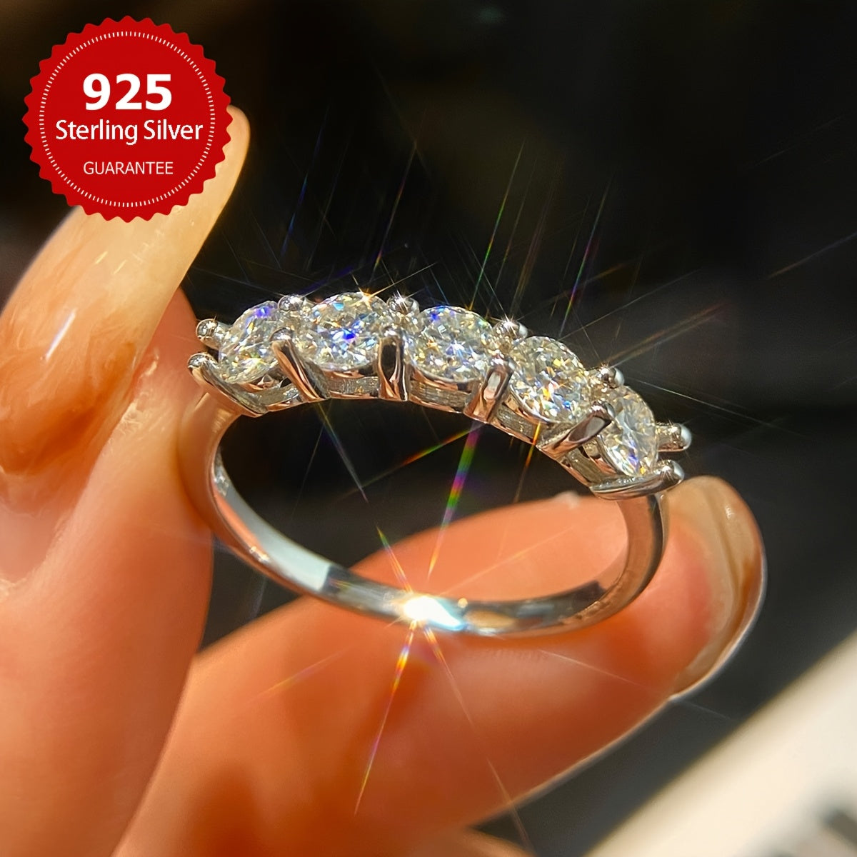 A stunning engagement ring with 7 pieces of 0.3 carat Moissanite set in S925 pure silver. This hypoallergenic ring is perfect as a promise ring or eternal ring, ideal for anniversaries and Valentine's Day. It makes a luxurious gift for women, with