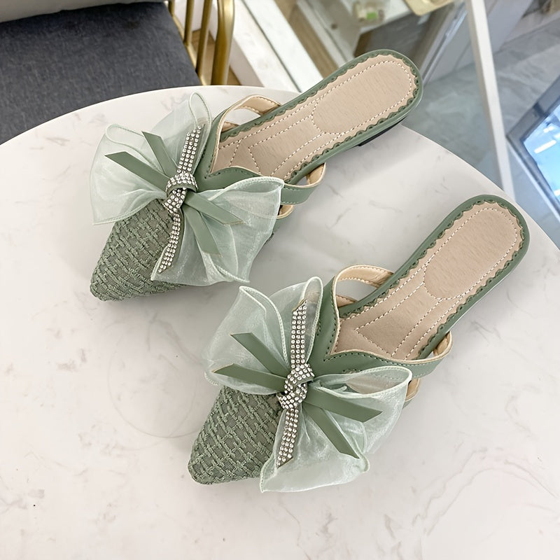 Stylish slip-on mules with bowknot, pointed toe, and flat heel for year-round wear.