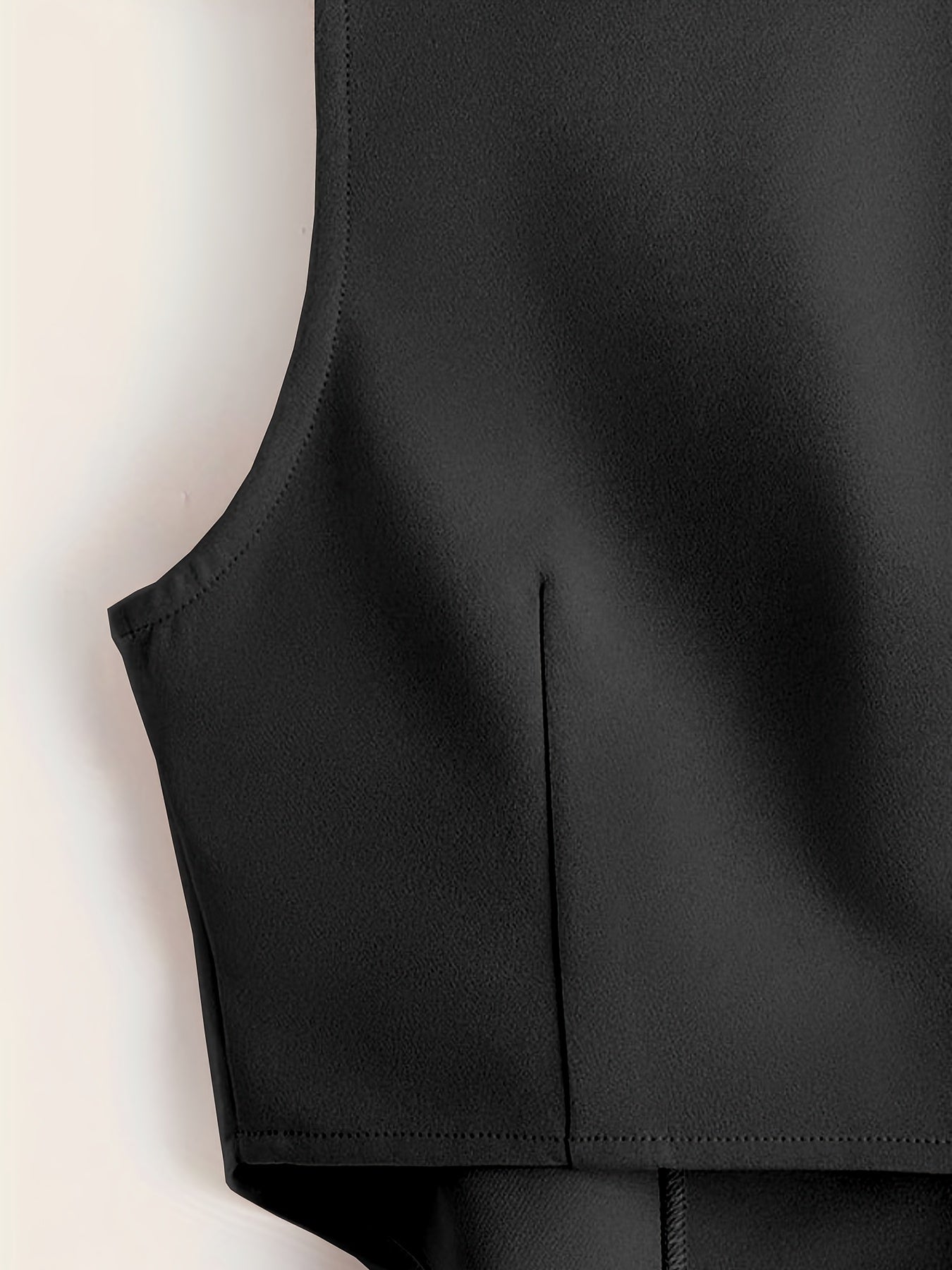 Sleeveless button-front vest with V-neck for women's workwear.